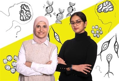 Two women stand side by side with their arms crossed surrounded by drawings of genes and brains.