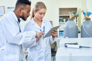 Two researchers reviewing lab results.