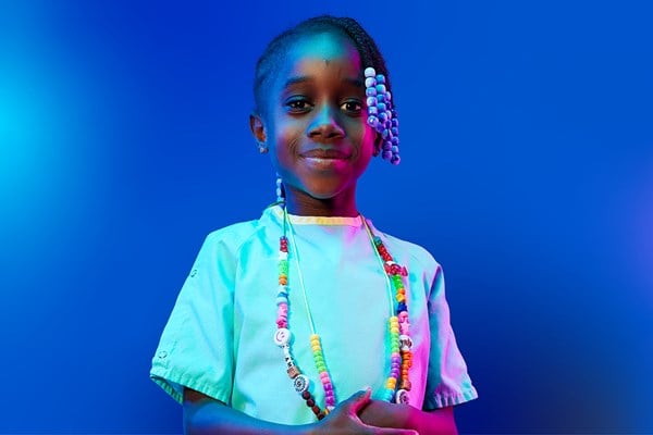 A child wearing Bravery Beads around her neck