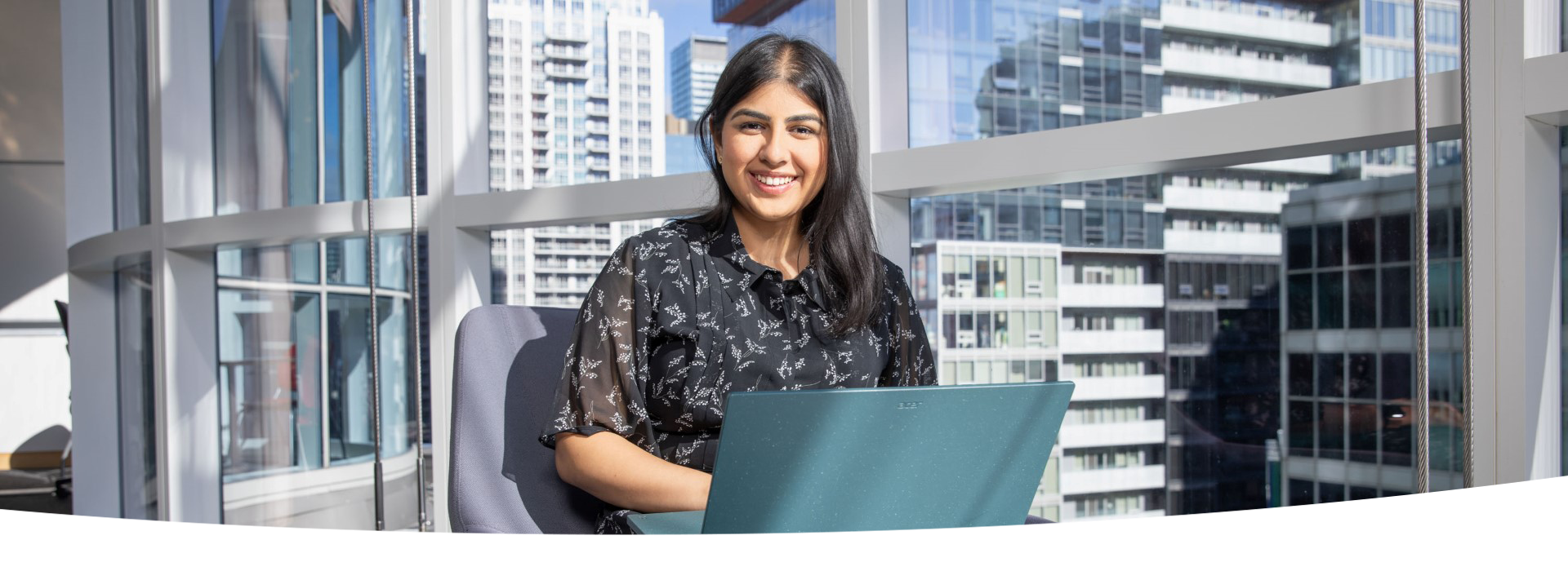 Person seated, using a laptop.